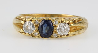 An 18ct yellow gold sapphire and diamond ring, size N 1/2 
