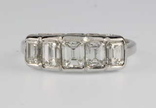 An 18ct white gold 5 stone graduated baguette cut diamond ring, approx 2ct, size M 1/2