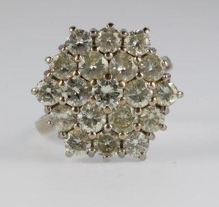 An 18ct white gold 19 stone diamond cluster ring, approx 4ct, size O