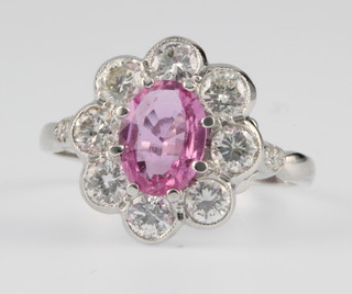 An 18ct white gold pink sapphire and diamond cluster ring, the centre stone approx 1.25ct surrounded by 8 brilliant cut diamonds approx. 1ct, size O