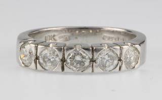 An 18ct white gold 5 stone diamond ring, size M 1/2