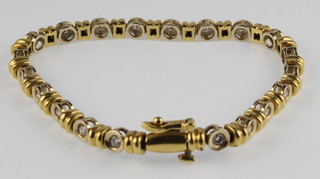 An 18ct  yellow gold 20 diamond set bracelet, 22 grams