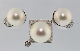 A pair of 18ct white gold diamond and pearl ear studs together with a ditto pendant 