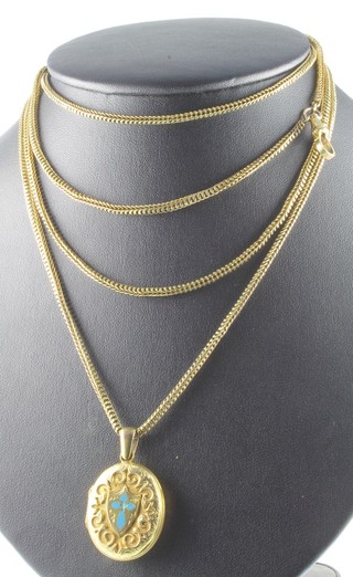 A Victorian gilt muff chain and locket