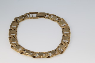 A 9ct gold gentleman's bark finished bracelet 28 grams