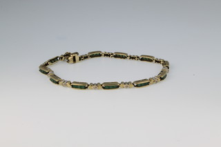A 9ct gold gem set emerald and diamond bracelet 