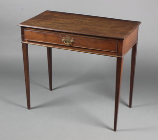 A Georgian rectangular mahogany side table fitted a frieze drawer and raised on square tapering supports 27 1/2"h x 31"w x 16"d 