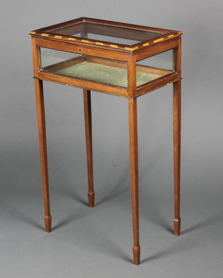 An Edwardian rectangular inlaid mahogany bijouterie table, raised on square tapered supports, spade feet 30"h x 17"w x 11 1/2"d 