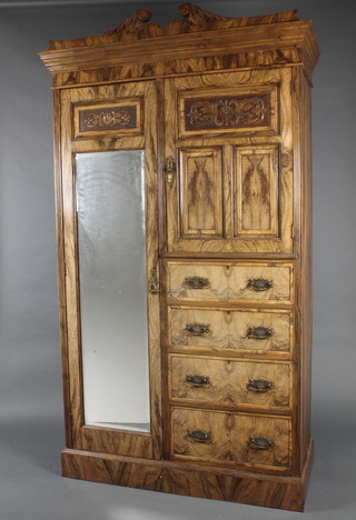 A Victorian carved "laburnum" 3 piece bedroom suite comprising combination wardrobe fitted a hanging compartment with cupboard to the side above 4 long drawers, raised on a platform base, 89"h x 50 1/2"w x 21"d, a dressing table with mirror above 2 glove drawers and a recess, the base fitted 2 long and 3 drawers with undertier, raised on square tapering supports 66"h x 42"w x 22"d and a bedside cabinet with raised back 27 1/2"h x 15"w x 15"d 