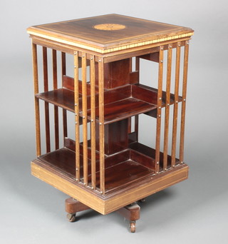 Maples & Co, an Edwardian square mahogany revolving bookcase 34"h x 19 1/2"w x 19 1/2"d 