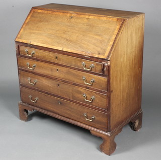 A Georgian mahogany bureau, the crossbanded fall front revealing a well fitted interior above 4 long graduated drawers, raised on bracket feet 37"h x 35 1/2"d x 19"w  