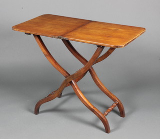 A 19th Century rectangular mahogany folding coaching table 27"h x 34 1/2"l when opened x 17" when closed by 16 1/2"d 