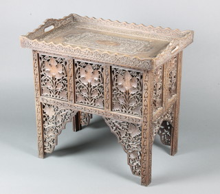 A carved and pierced Burmese hardwood rectangular tray raised on a pierced stand 23"h x 24"w x 16 1/2"d 