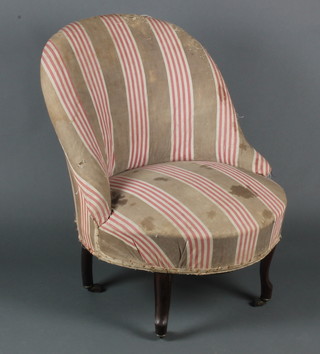 A Victorian tub back chair upholstered in striped material