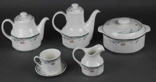 A Royal Doulton Juno pattern tea, coffee and dinner service, comprising 8 coffee cups, 8 tea cups, 8 coffee saucers, 8 tea saucers, a milk jug, cream jug, sugar bowl, slop bowl, teapot, coffee pot, 9 small plates, 10 medium plates, 14 dinner plates, 8 small bowls, 6 soup bowls, 2 tureens and covers, a gravy boat, 2 oval serving dishes, an oval meat plate and a circular dish 