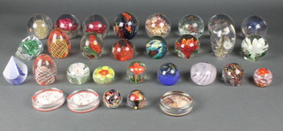 A collection of modern glass paperweights