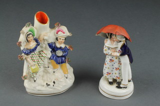 A Staffordshire figure of a couple beneath an umbrella 6", a ditto spill vase 6" 
