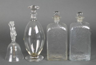 A pair of 19th Century Continental decanters and stoppers, 1 other and a figural glass bell