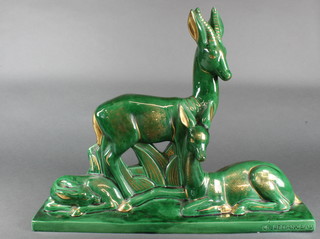 An Art Deco style green glazed gilt decorated group of 3 deer impressed C H. Lemanceau 22" 