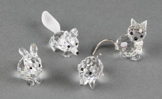 A Swarovski figure of a cat 1" and 3 other Swarovski animals