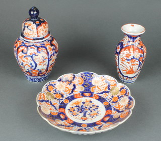 An Imari scalloped dish decorated with flowering peony 9", a ditto vase 5" and baluster vase and cover 8" 