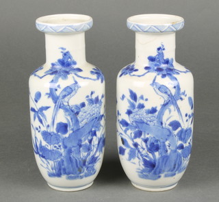 A pair of early 20th Century Chinese cylindrical vases decorated with birds amongst trees, bearing a 4 character mark 8" 