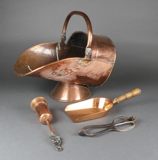 A polished copper helmet shaped coal scuttle, ditto shovel 