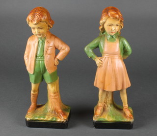 A pair of 1930's plaster figures of a standing boy and girl 12" 