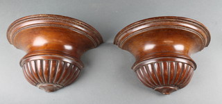 A pair of turned mahogany brackets 6"h x 11"w x 5 1/2"d 