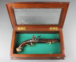 Blythe, an 18th Century flintlock coaching pistol with 9" barrel, contained in a mahogany display cabinet 