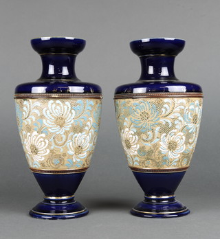 A pair of Royal Doulton oviform vases with dark blue ground with a band of flowers 10" 