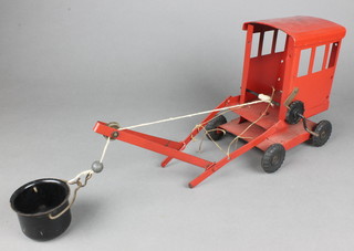 A red Tri-ang metal crane 