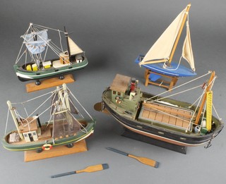 A wooden model of a fishing boat 11" and 2 others 