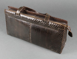 A lady's brown snake skin bag