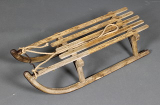A vintage slatted wooden toboggan 