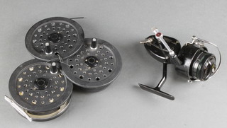 A Shakespeare 2756 graflite centre pin fishing reel 3", 2 spare spools and a Mitchell 300 fishing reel 