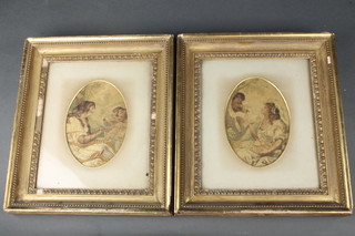 A pair of 19th Century silk works, allegorical studies of a lady with children, oval, 6 1/2" x 4 1/2" 