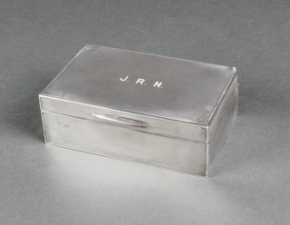 A silver engine turned cigarette box, London 1938 5 1/2" x 3 1/2" 
