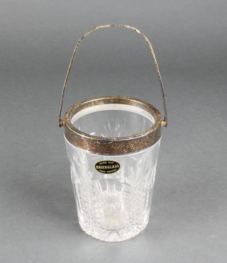A cut glass ice bucket with silver plated mounts 