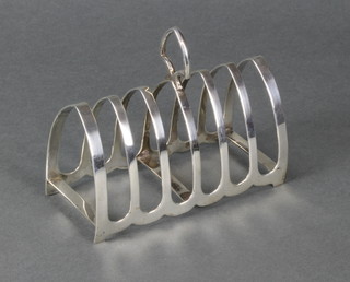 A silver 7 bar arched toast rack, Sheffield 1936, 148 grams