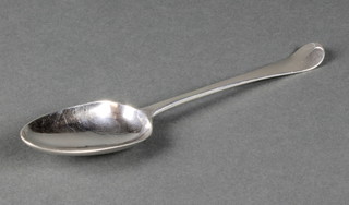 A George III silver table spoon with shell back and engraved monogram, London 1773, 70 grams
