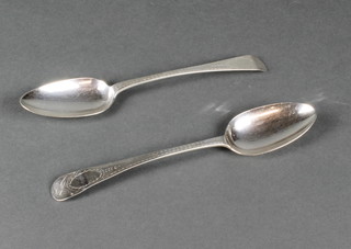 A pair of George III silver table spoons with bright cut decoration, London 1809, 104 grams 