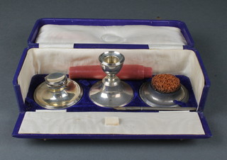 An Art Deco cased silver 4 piece desk set comprising inkwell, candlestick, nib cleaner and pen, Birmingham 1938 