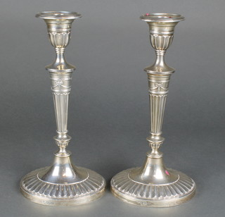 A pair of Adam style oval silver candlesticks, London 1910 11 1/2" 