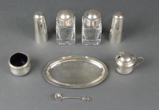 A Continental silver oval dish, 3 pairs of condiments and a spoon