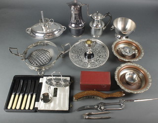 A silver plated entree set and a quantity of plated items 