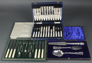A cased silver plated cake set, a ditto dessert set and a cased serving set 