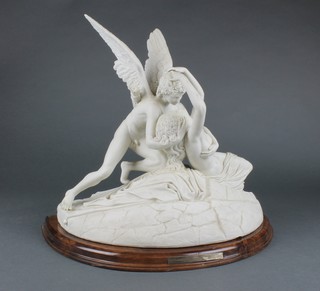 A modern Parian classical group of 2 figures on a rocky outcrop 15" on a wooden base 