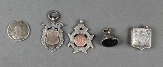 2 silver sports fobs and 3 other items