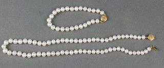 A cultured pearl necklace with a 14ct gold yellow clasp 18" and an ensuite bracelet 